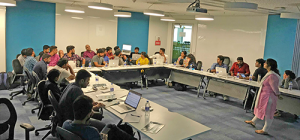 Freshworks Designers sitting around a u-shaped table while attending a Deque-led instructor training.