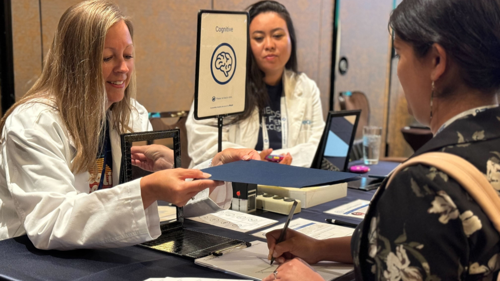 Deque's Katie Olson, engaging with a guest at the Cognitive Station